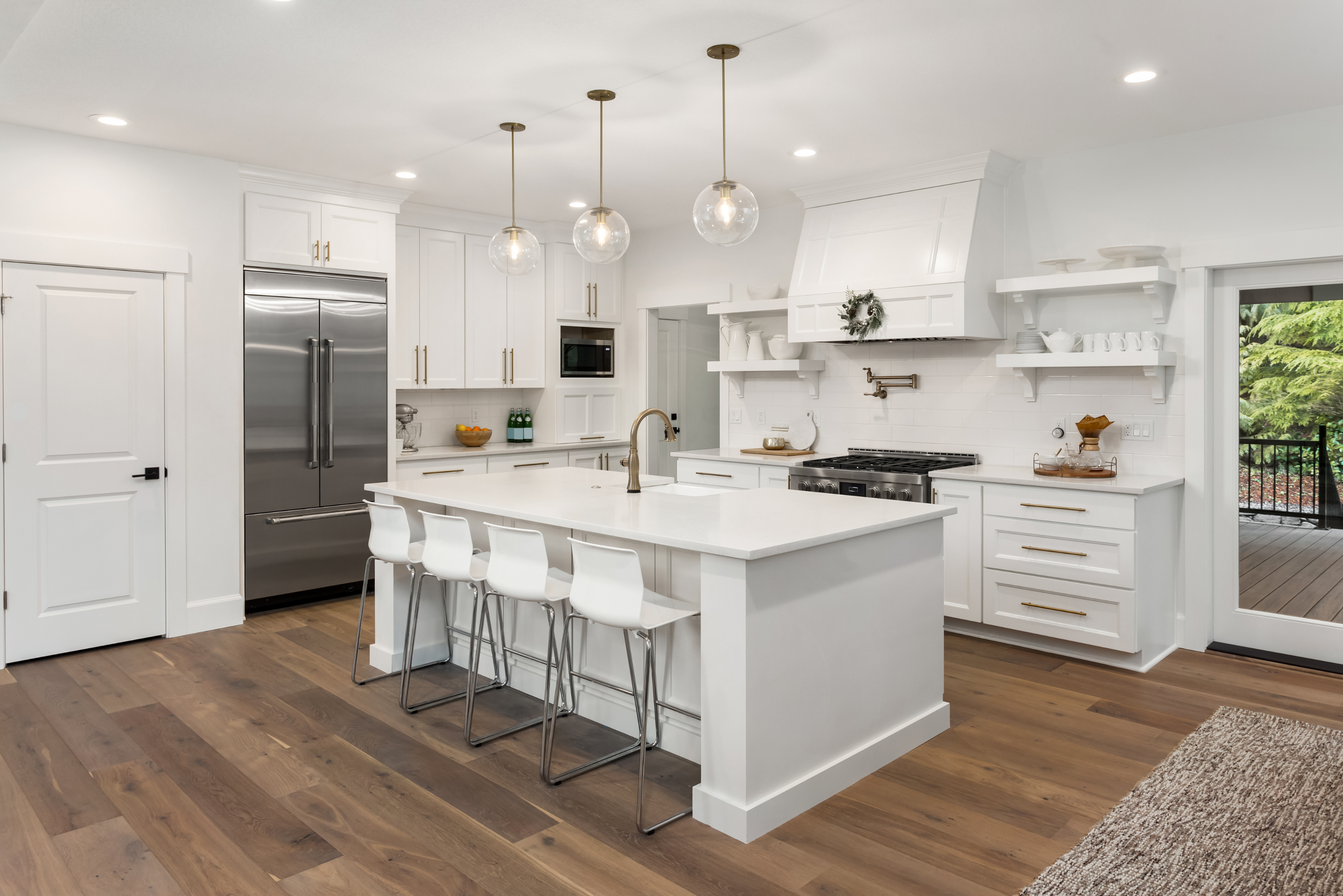 Designer reviewing Hollywood homeowner’s measurements at showroom table